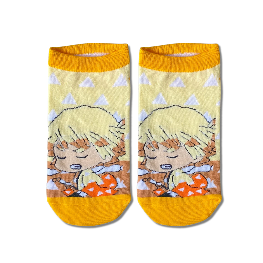 Demon Slayer Zenitsu Chibi ankle socks by Socks Up, chibi Zenitsu sleeping on a pale yellow pattern with orange toes