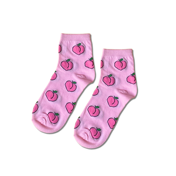 Peaches mid crew socks by Socks Up, pink with a peach fruit print, pair on white