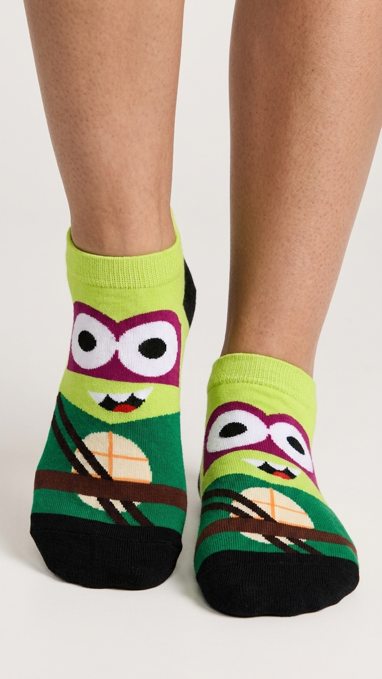 Colorful Ninja Turtles character socks with lime green, purple, green, black.