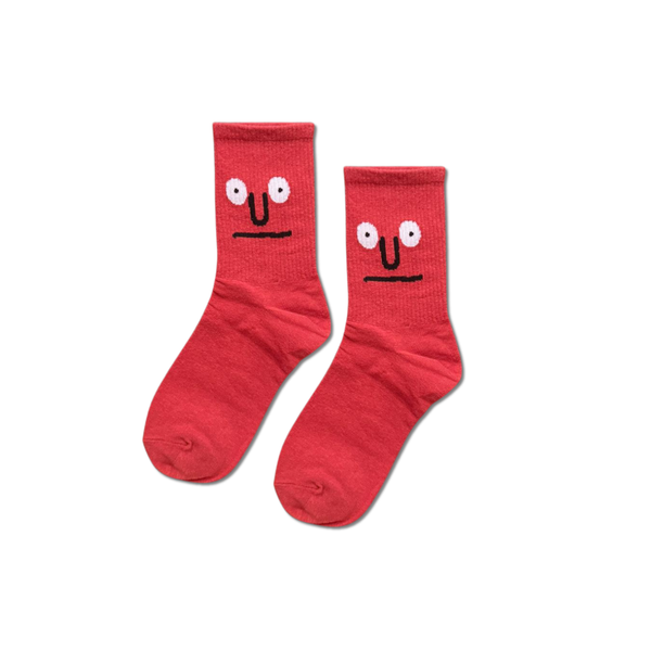 Brown Face patterned socks displayed on neutral background