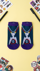 Pair of purple and teal Demon Slayer socks featuring a wrapped mummy.