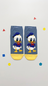 # Alt Text

Pair of blue and yellow Donald Duck socks featuring the character's face with sailor hat, red bow tie, and y